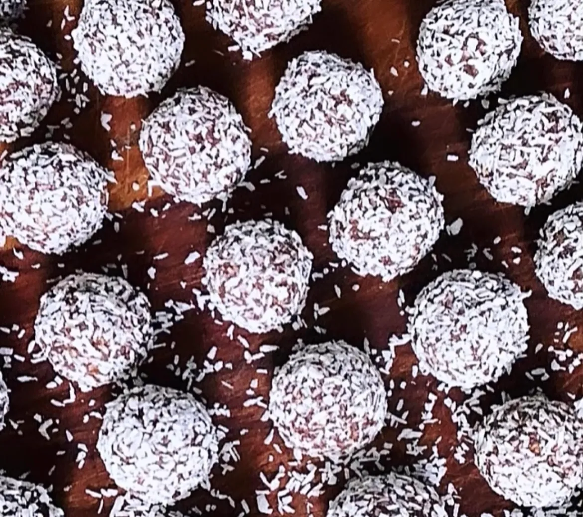 Cocoa Coconut Protein Bakes dusted in coconut