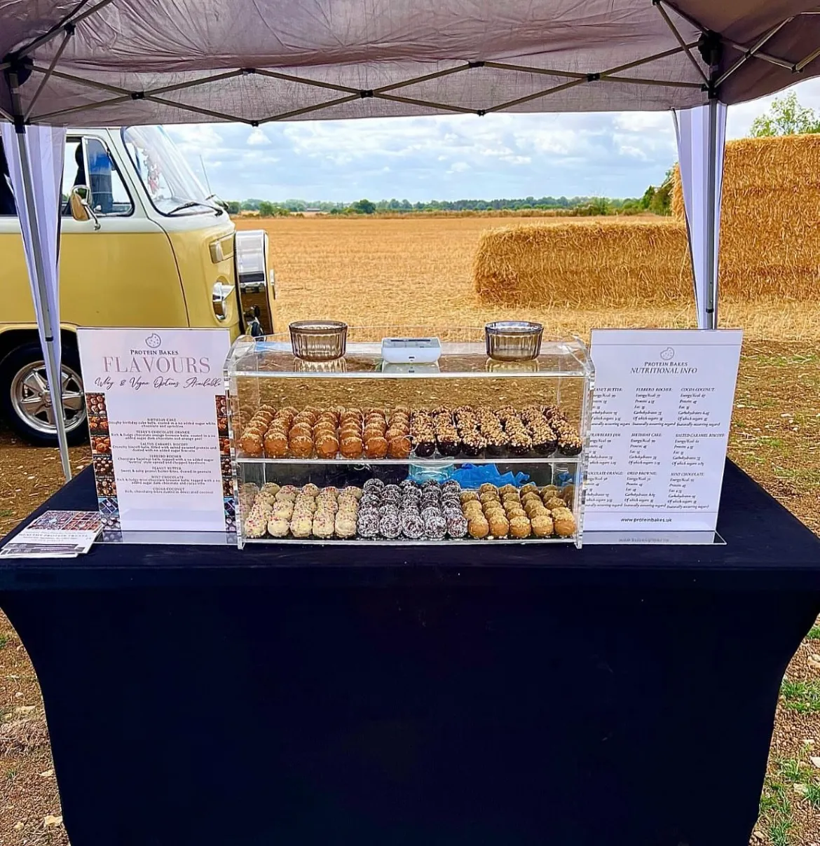 A Protein Bakes stand at an outdoor event